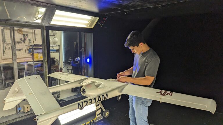 Undergraduate research assistant working on UAS platform for wind tunnel testing.