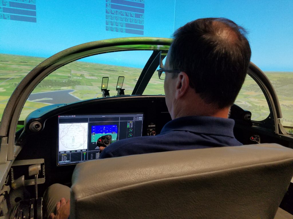 FAA research pilot David Sizoo flies in engineering flight simulator